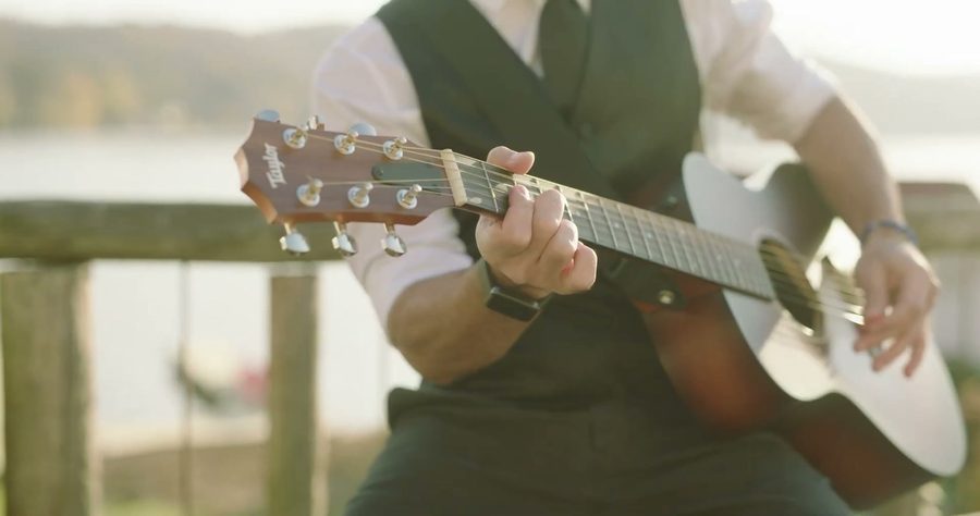 Trevor James playing lakeside at golden hour