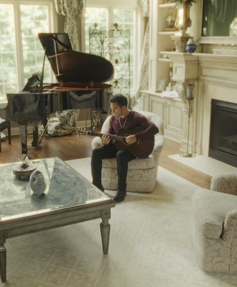 Trevor James playing in a piano room