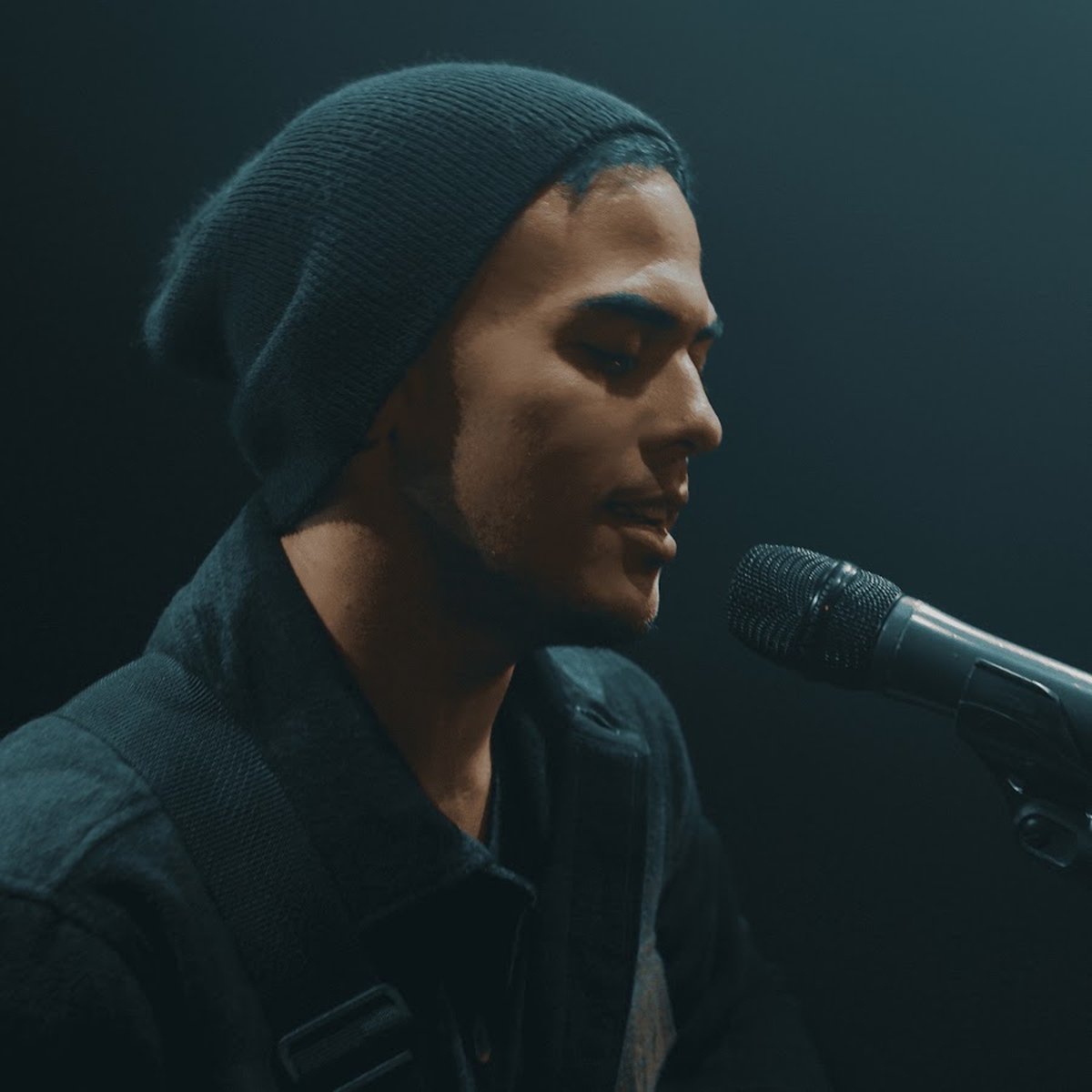 Trevor James at a microphone